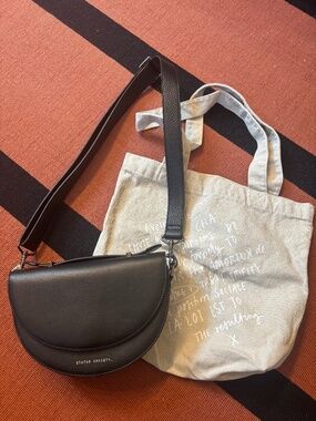 Status Anxiety black leather shoulder bag